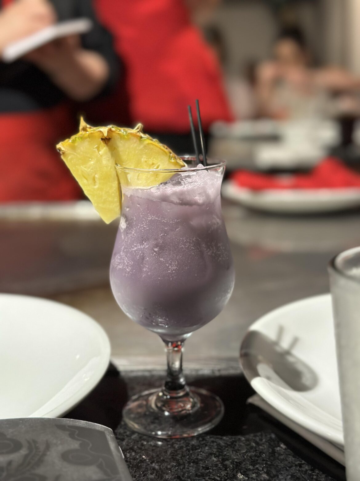 [OC] Purple Party Colada from Benihana. Ube blended with lemon, coconut, pineapple & RumHaven Rum. Topped with a fresh pineapple slice. Delicious!