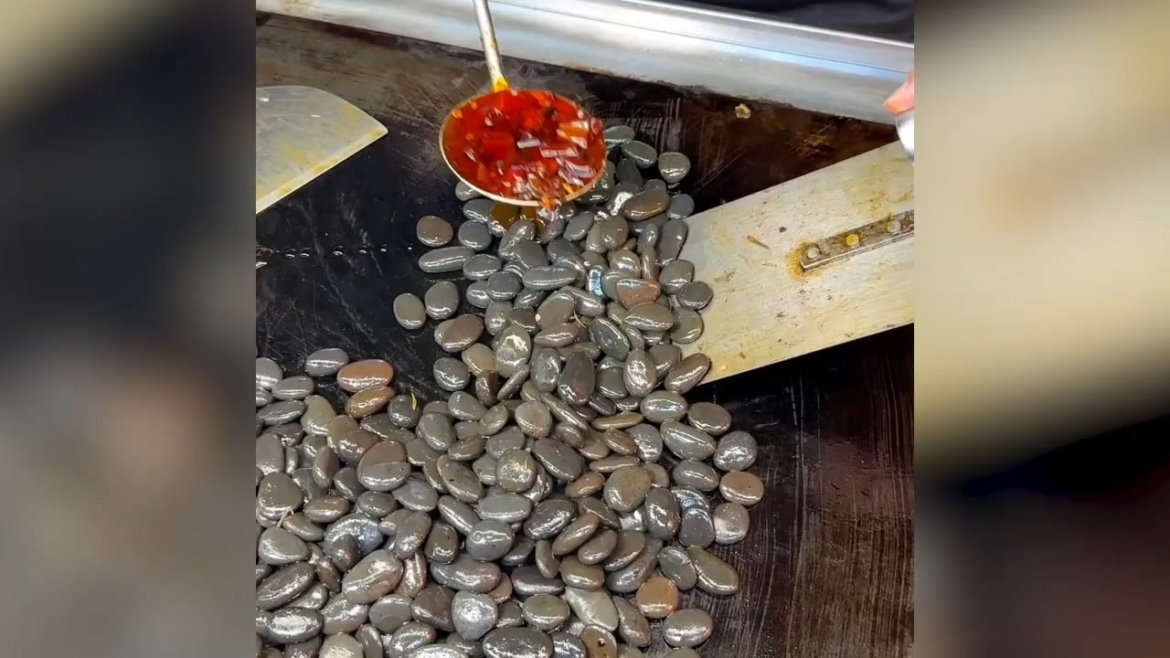Stir-fried pebbles sold as popular street food in China