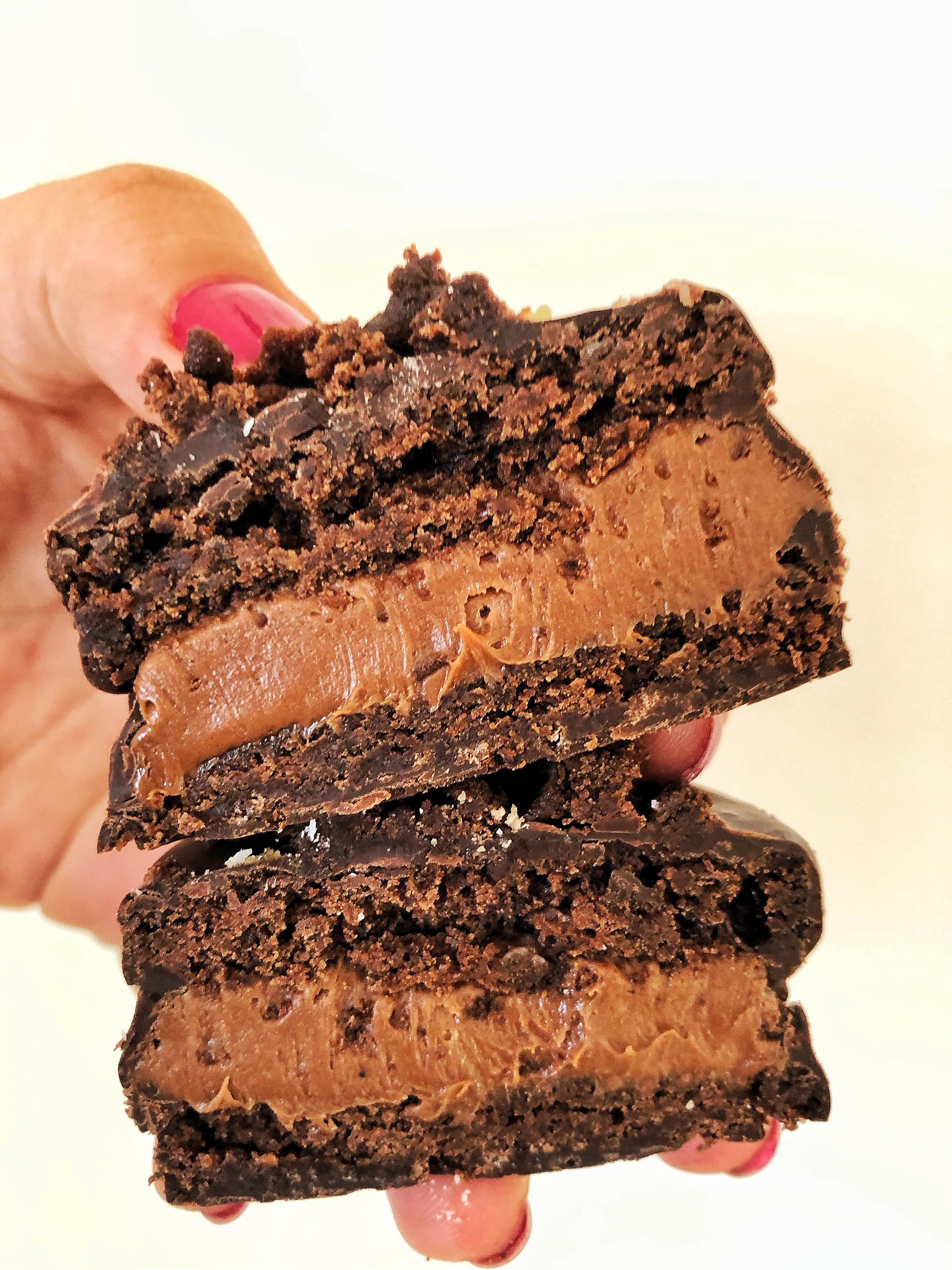 Brownie Alfajores with chocolate cream and chocolate covered liqueur