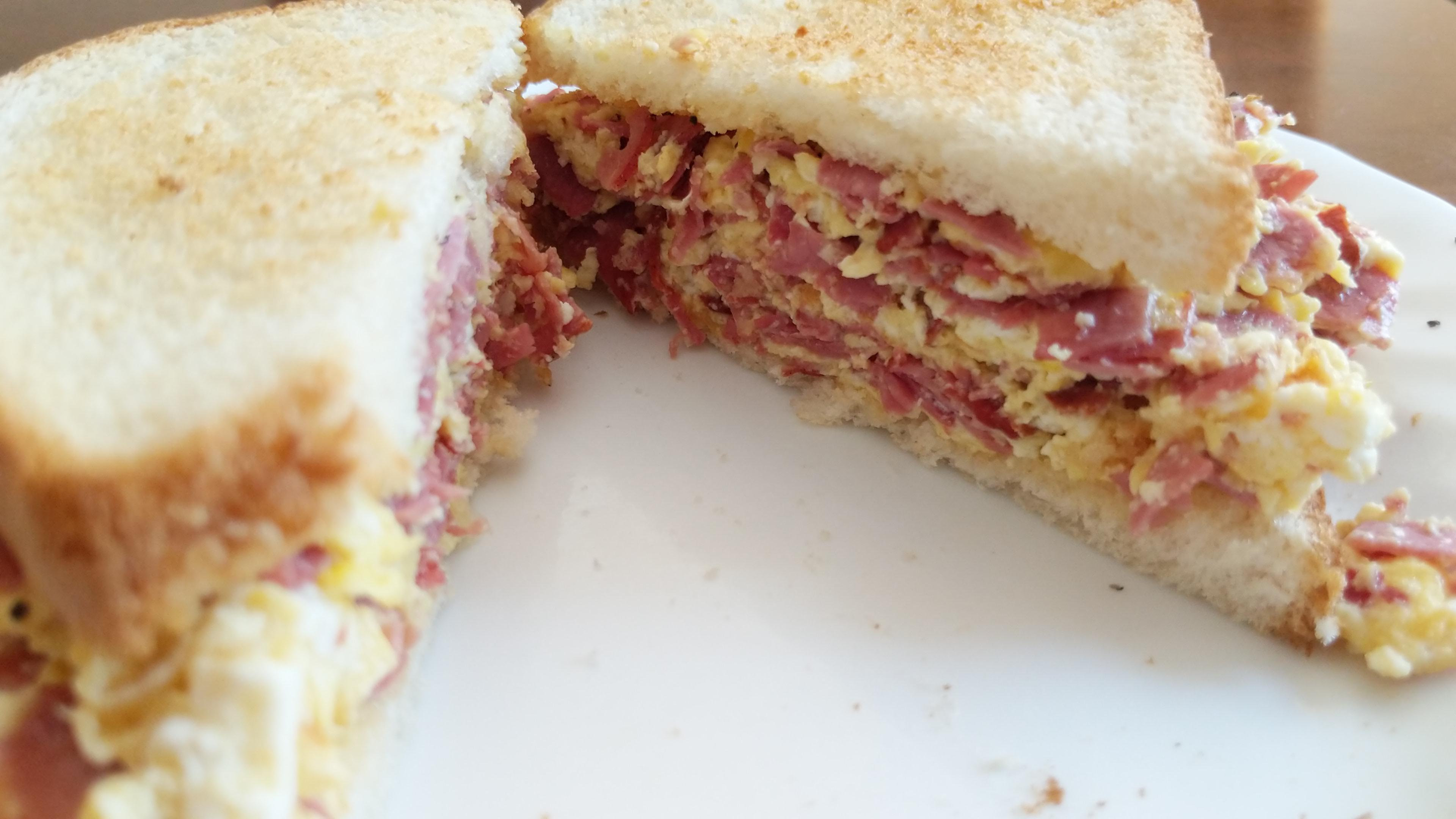 Pastrami, egg and ricotta on toast. Dining and Cooking