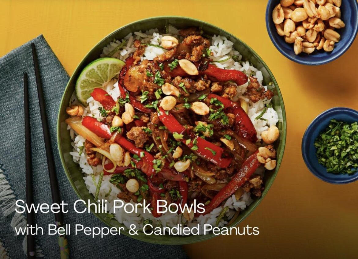 Cooked pork bowls on blacktop.