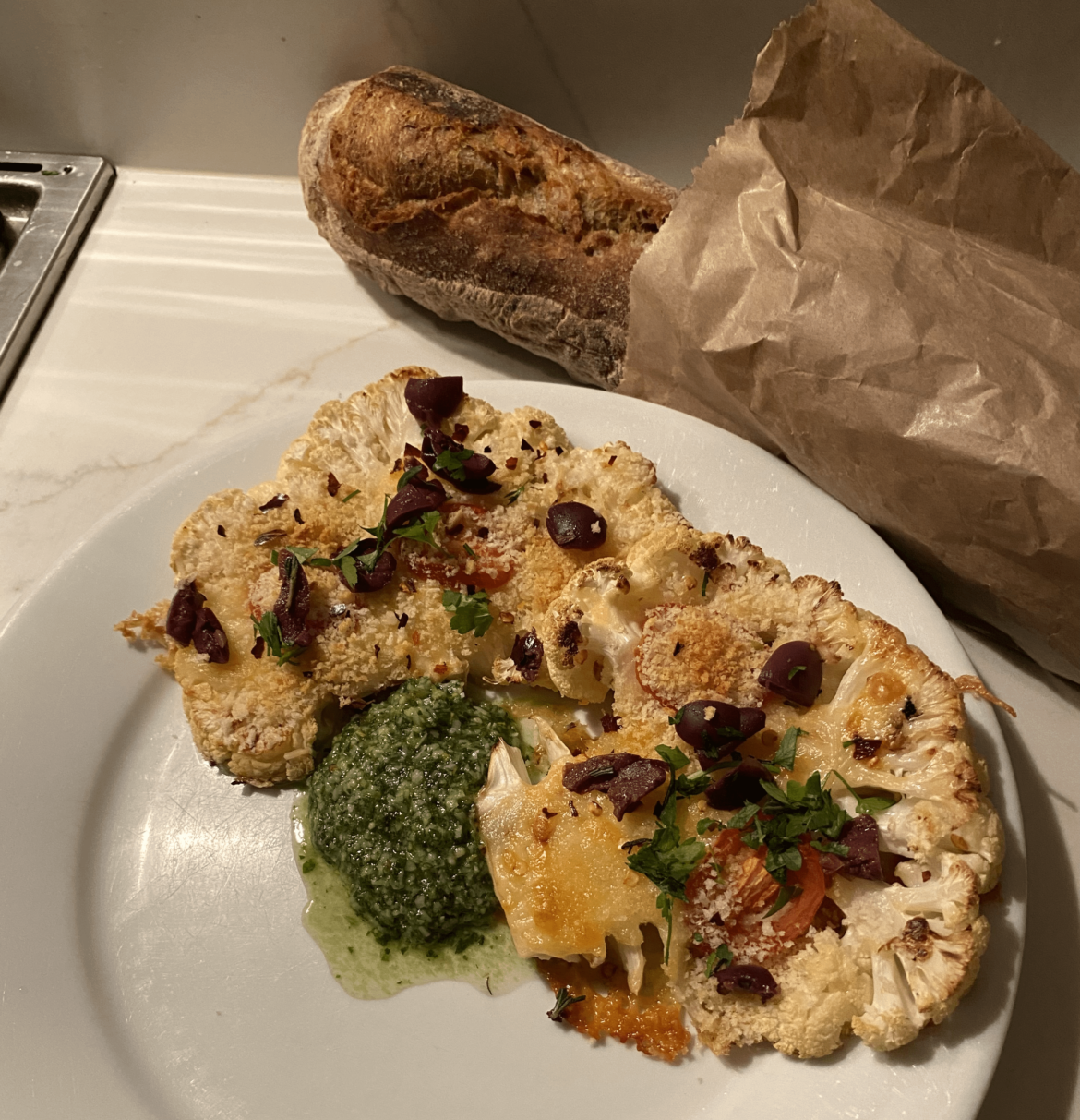 Cauliflower cheese steaks with pesto