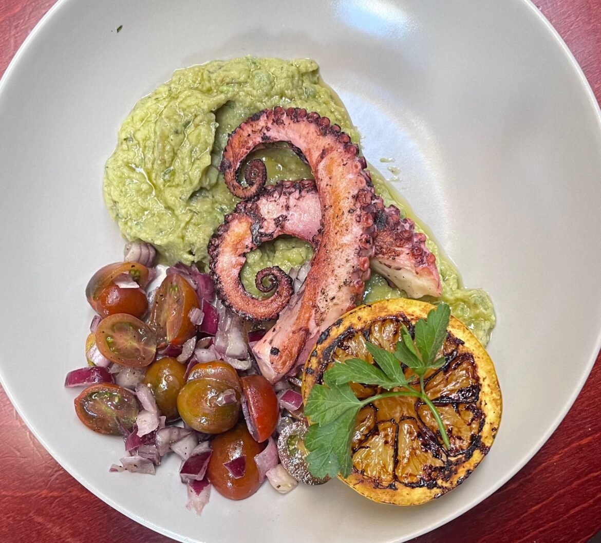 Pan seared octopus, with guacamole and ensalada tomate