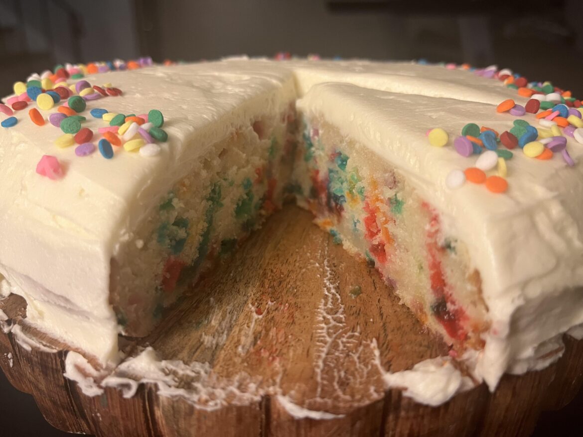 Completely homemade one layer sprinkle cake with vanilla buttercream