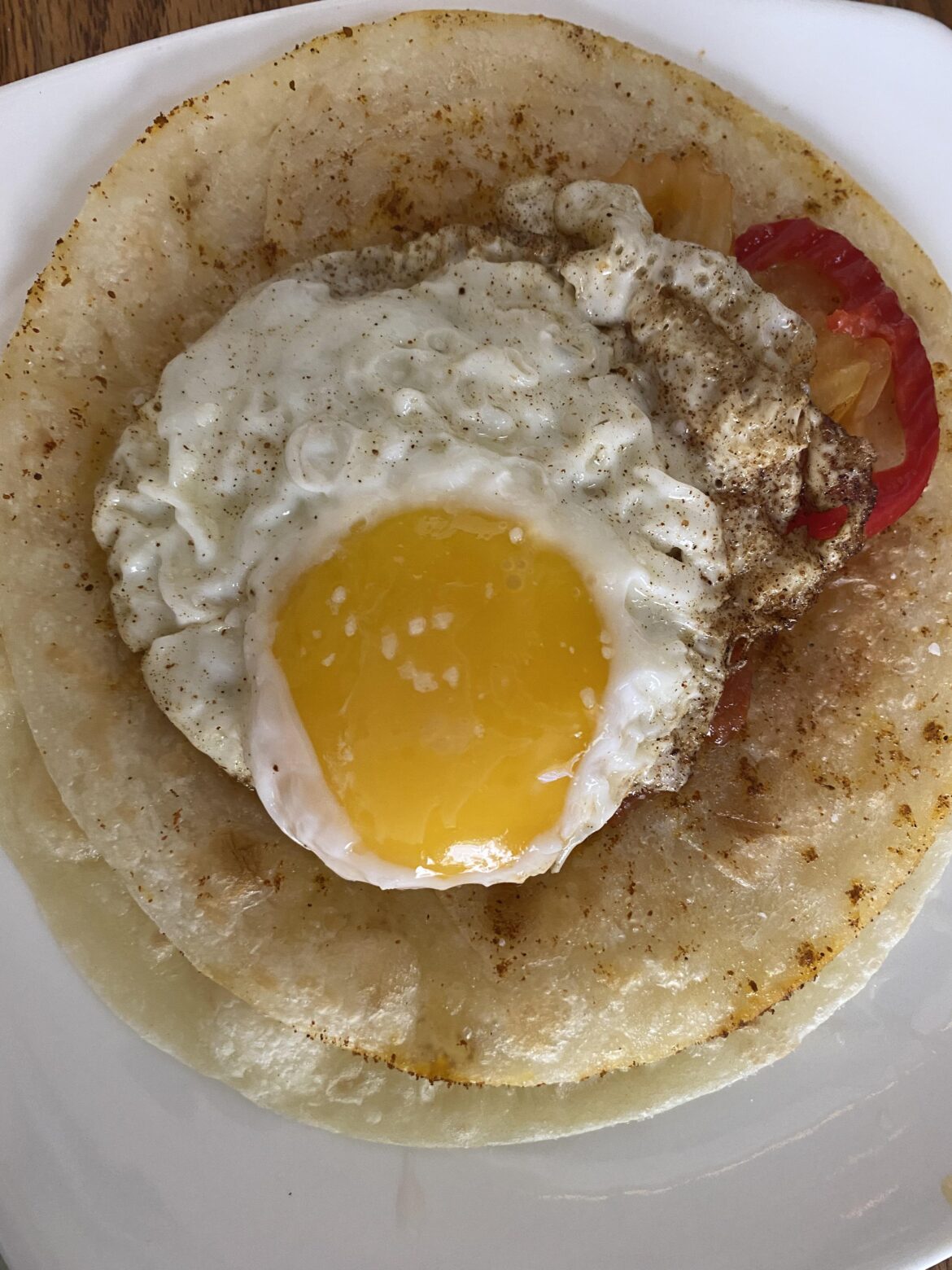 Egg on tortillas and salsa. Simple but delicious.