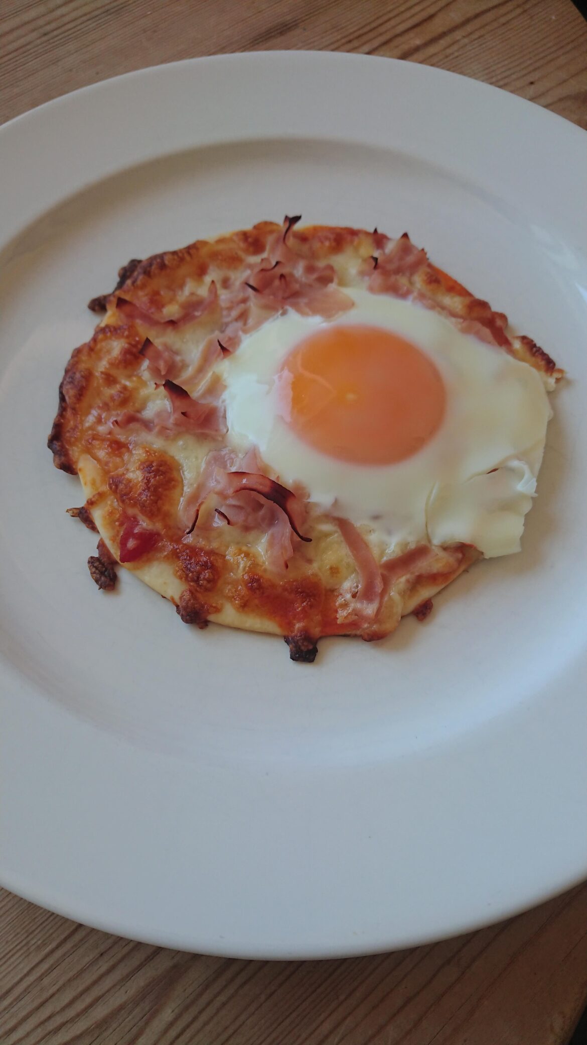 Mandatory egg on pizza