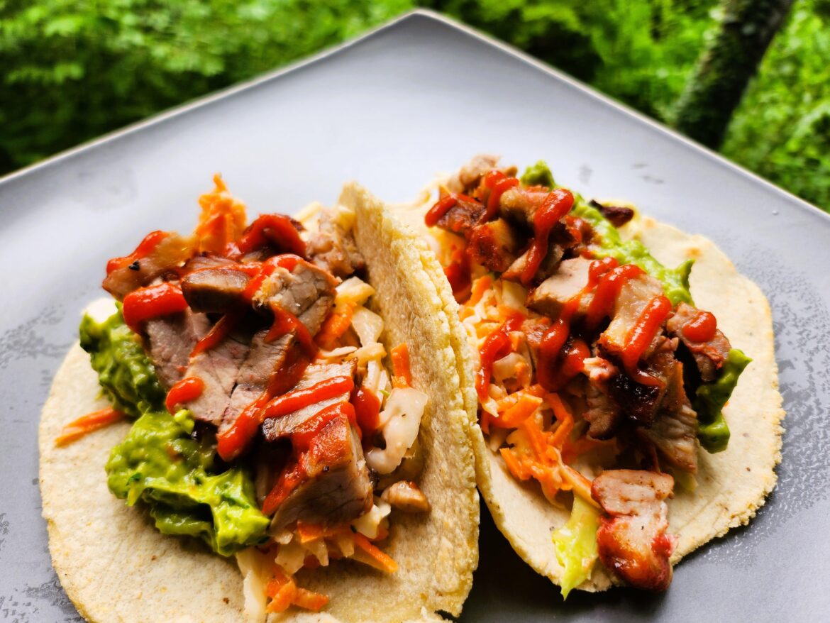 Leftover Char Sui Pork with Creamy Apple Slaw, Guacamole, and Sriracha on Homemade Corn Tortillas!