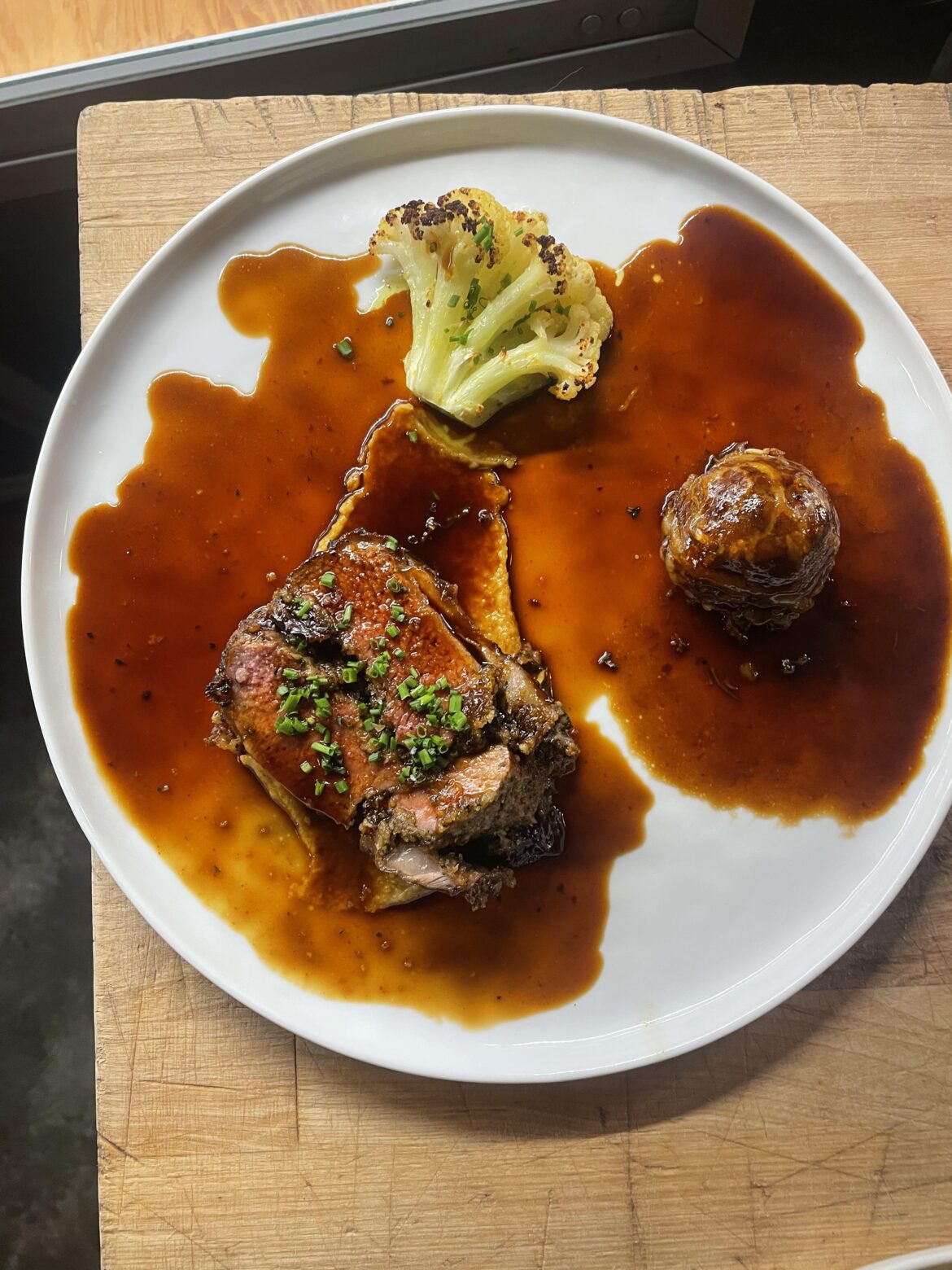 Stuffed lamb saddle, shank crepinette, cauliflower and garbanzo.