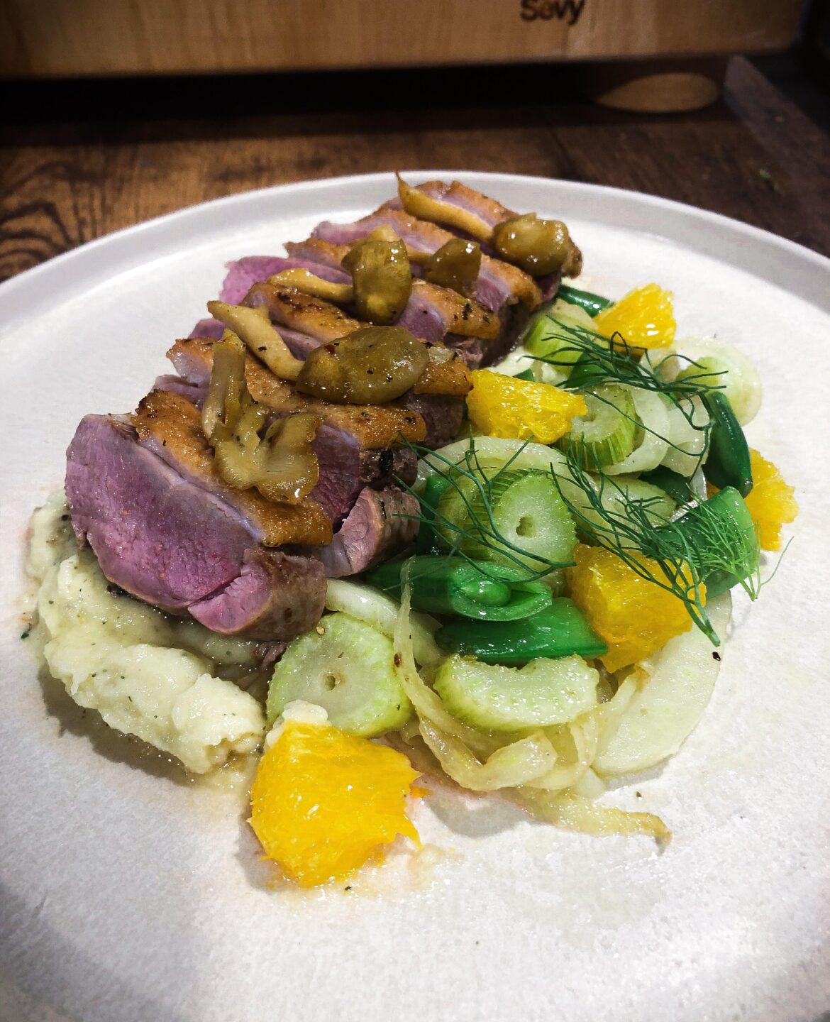 Duck with parsnip purée, sautéed veg.