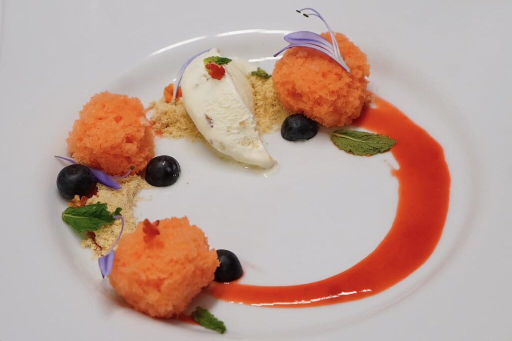 Almond Ice Cream with Nilla Cookie Crumbles, Raspberry Drizzle and Blueberries