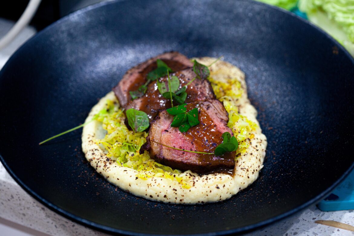 New York strip, potato and leek purée, sautéed cabbage with a smoked onion powder and a red wine jus