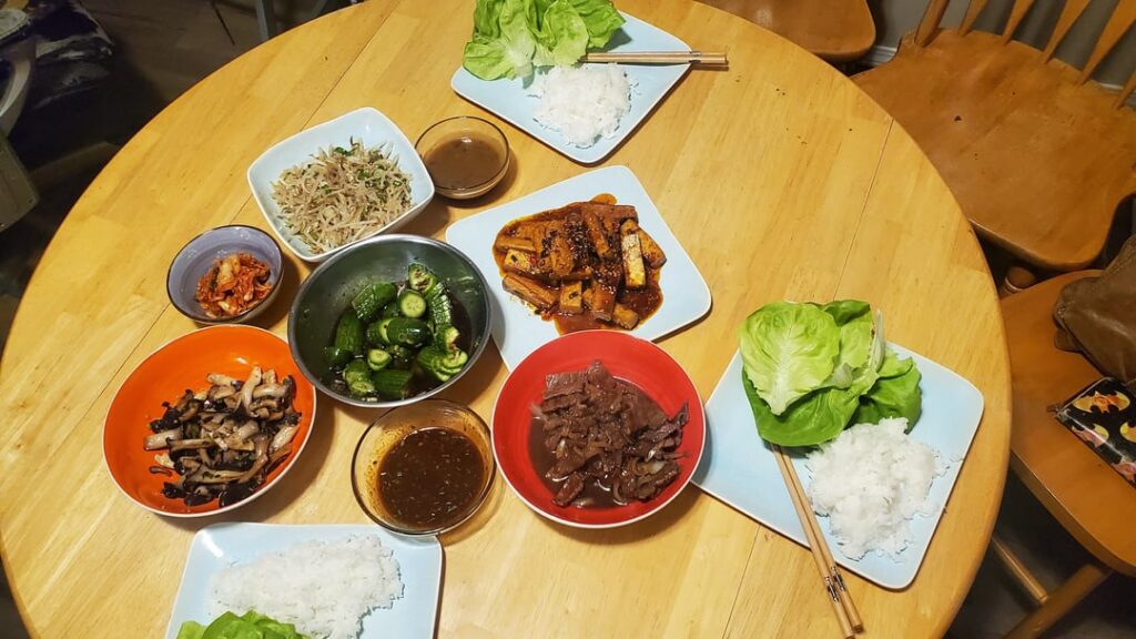 Bulgogi beef, Banchan, Neutari-beoseot-bokkeum, Dubu Jorim, and a couple sauces for fun. Served with Sticky rice, and butter leaf lettuce.