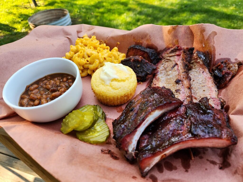 [Homemade] Smoked brisket, burnt ends, ribs, mac and cheese, baked beans, corn bread, and spicy pickles.