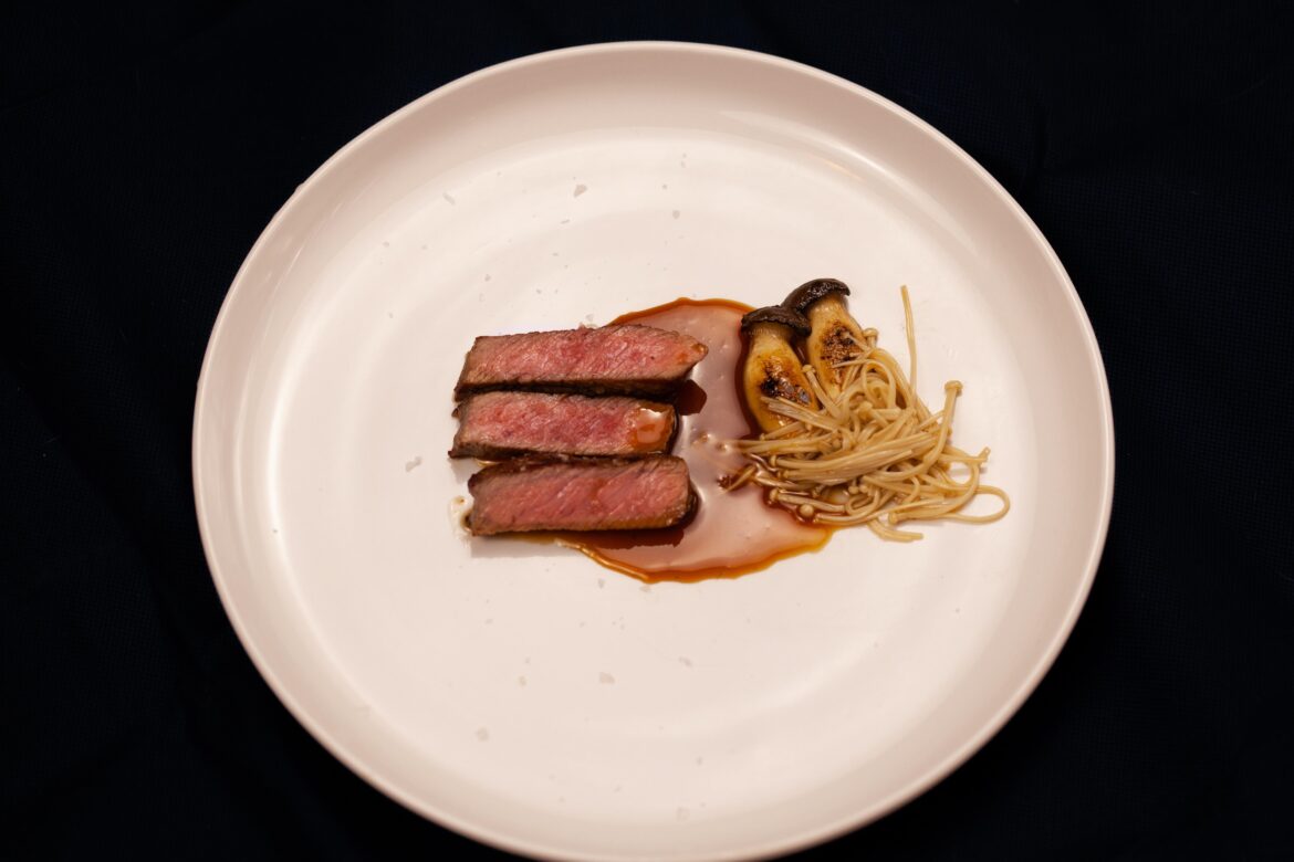 New York Strip, black garlic infused glacé, charcoal grilled oyster mushroom, poached enoki.