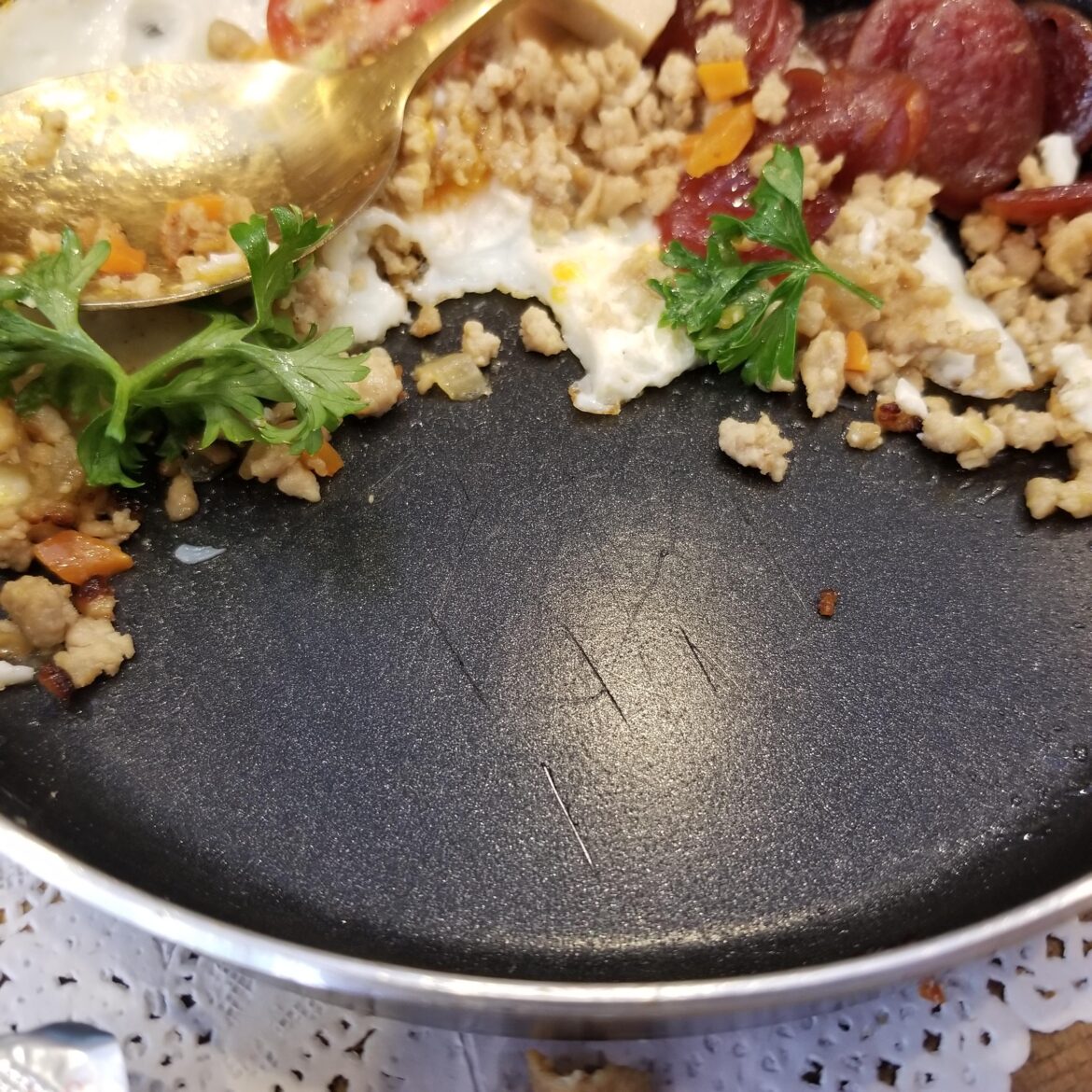 Brealing news: Someone was just served food at a restaurant on a scratched up Teflon skillet.