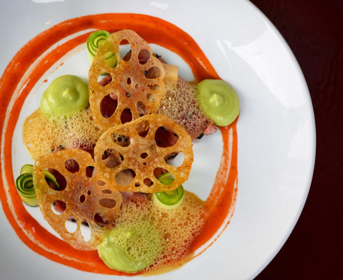 Seared Tuna, cucumber, avocado wasabi purée, lotus root, lacto fresno sauce, yuzu soy foam