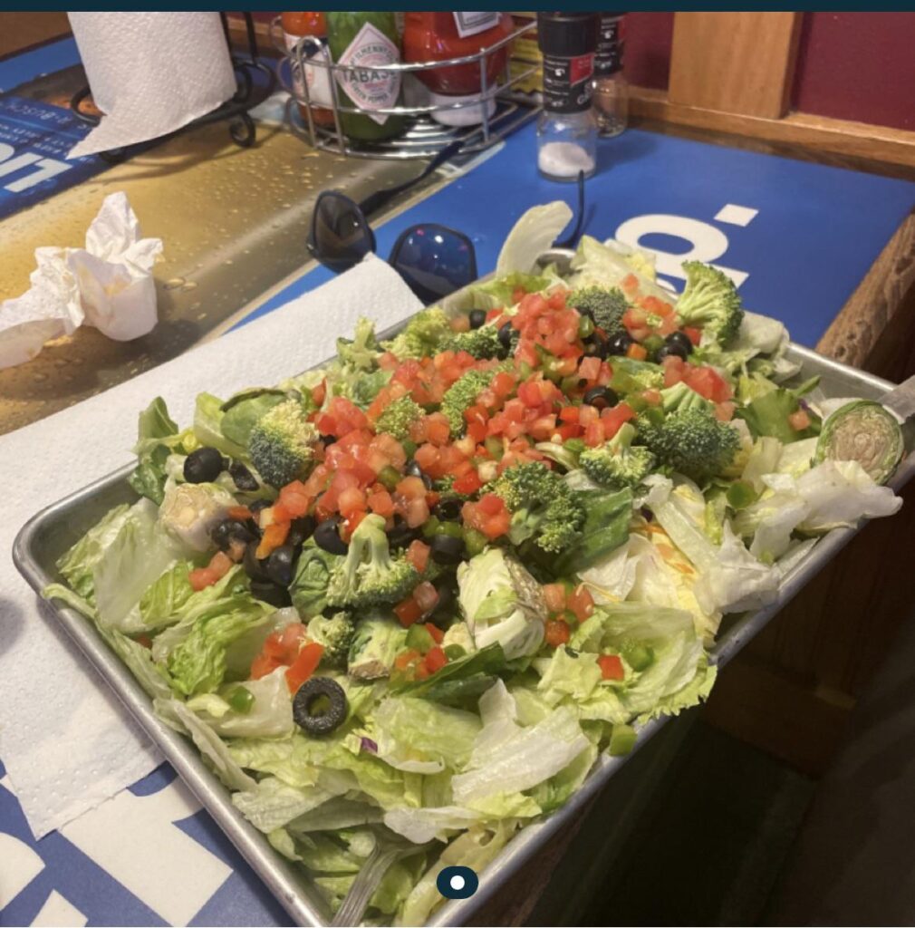 A fairly inedible salad served on a sheet pan. Raw Brussels! Barf.