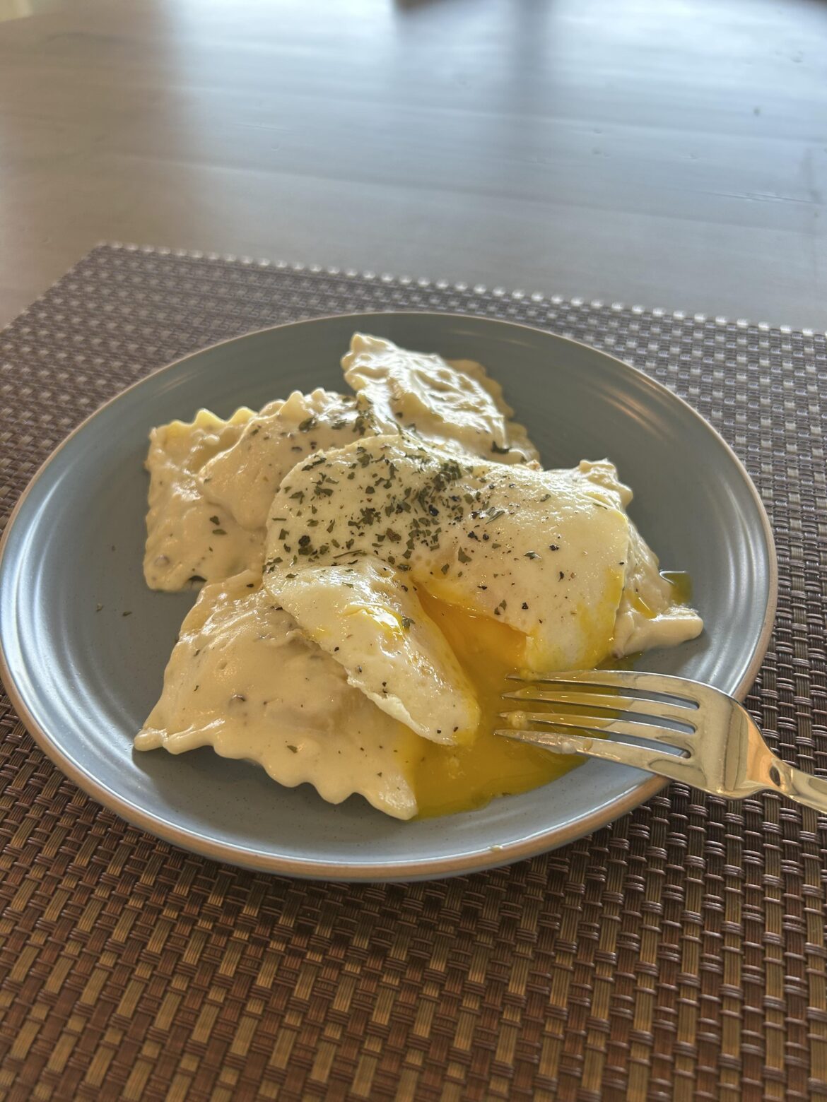 Threw an egg on top of some ravioli alfredo, I highly recommend!