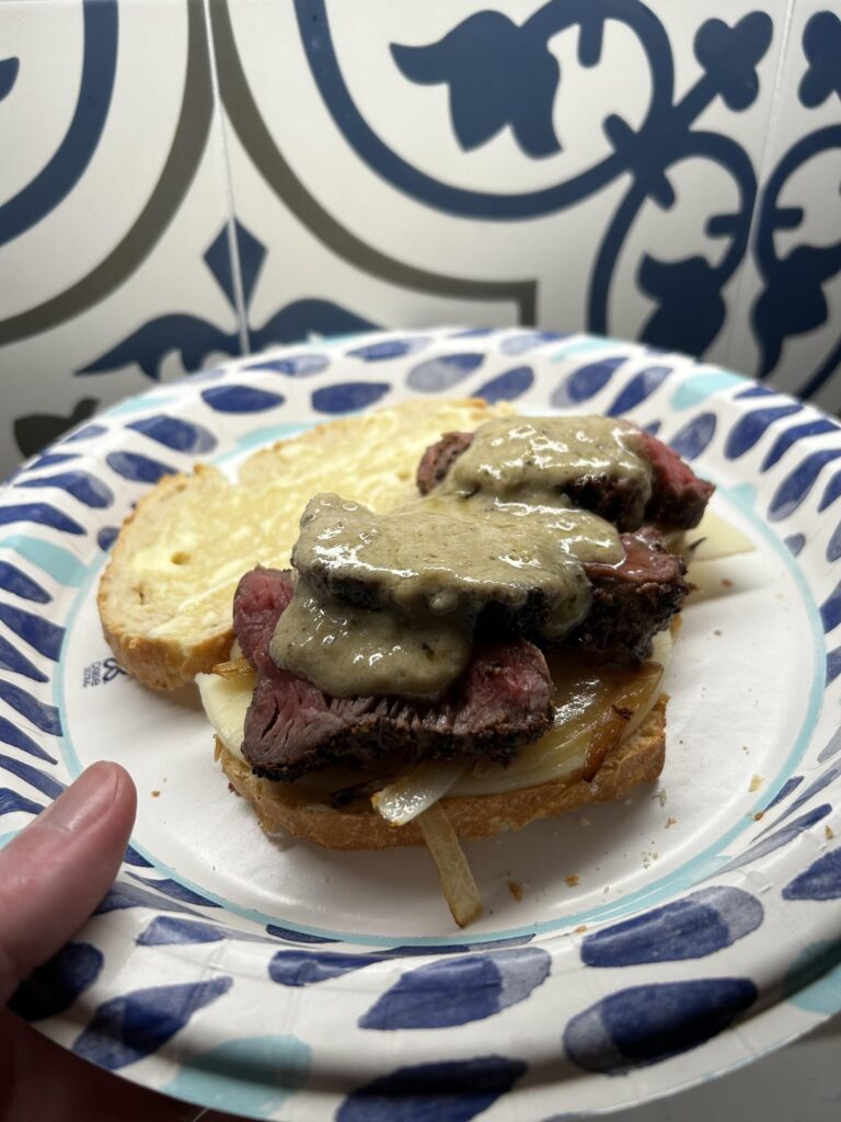 Filet with blue cheese sauce on roasted garlic French