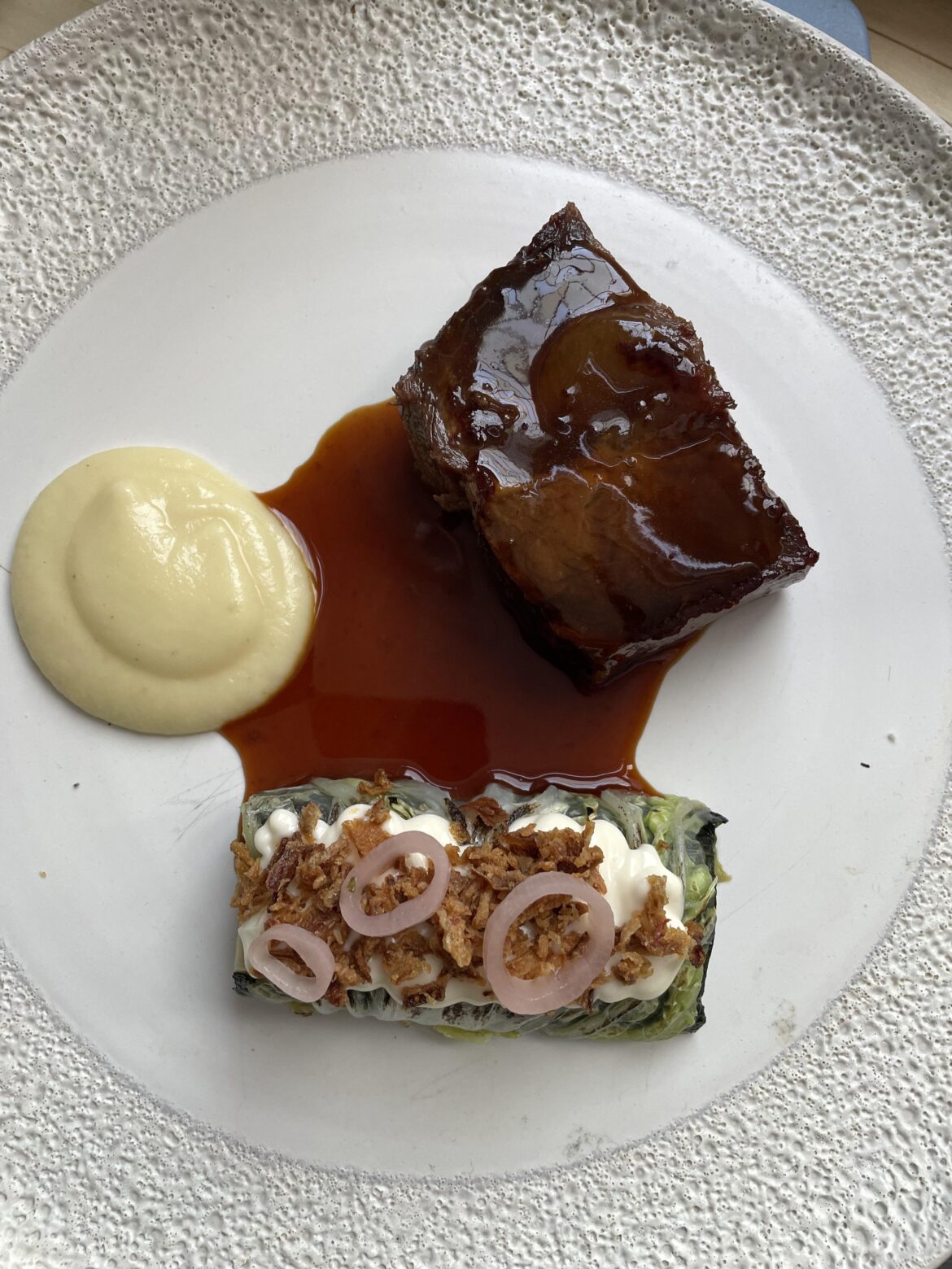 Sous vide flat iron steak with jus de veau, celeriac crème and white asparagus rouleaux with miso, nori and chinese cabbage