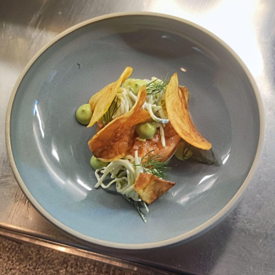 Salmon Tartar on horseradish Panna Cotta with creamcucumbers, a dill emulsion and potatoe chips