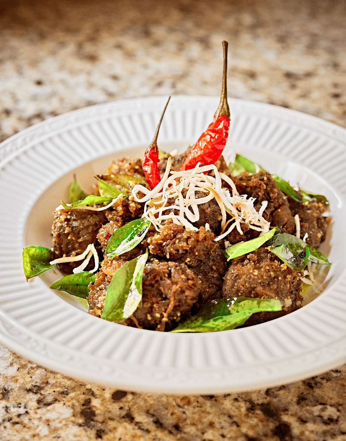 Beef, Fried Curry Leaves, Roasted Shredded Coconut, and Fried Thai Red Chili