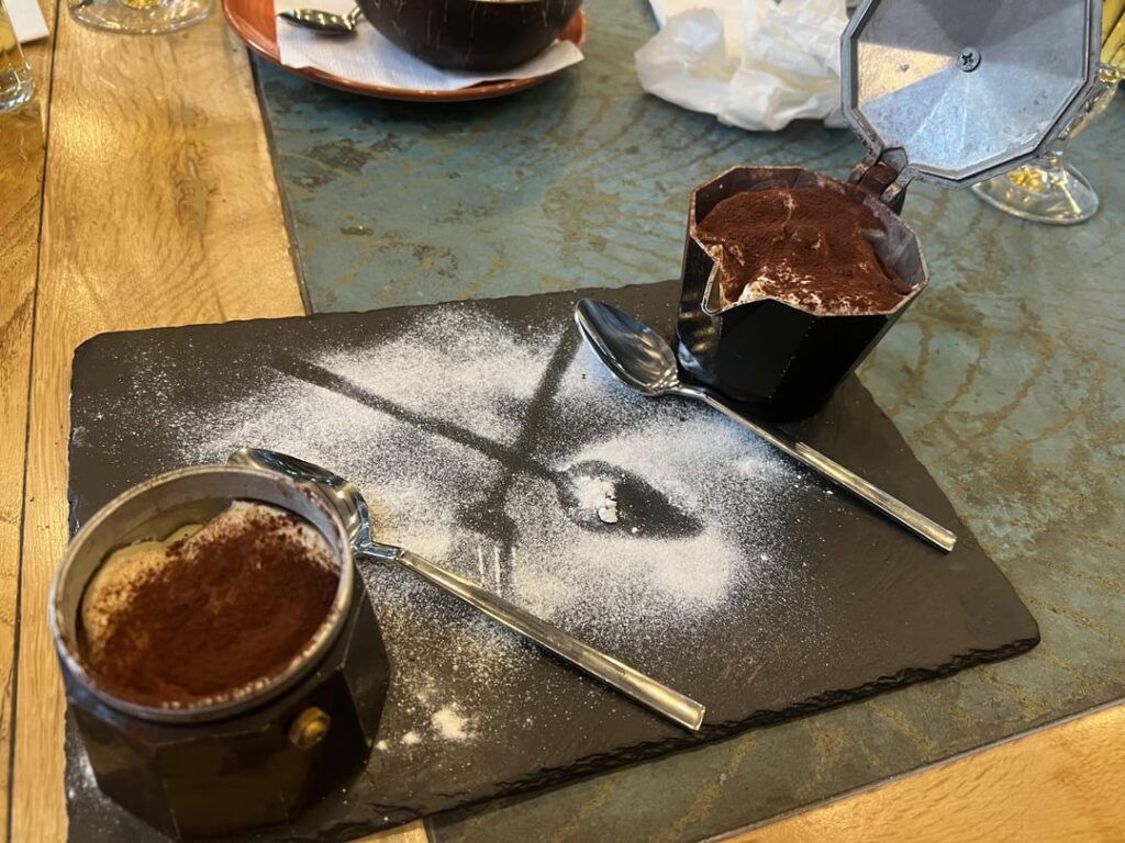 Tiramisu served inside a stovetop coffee maker (cezve?)