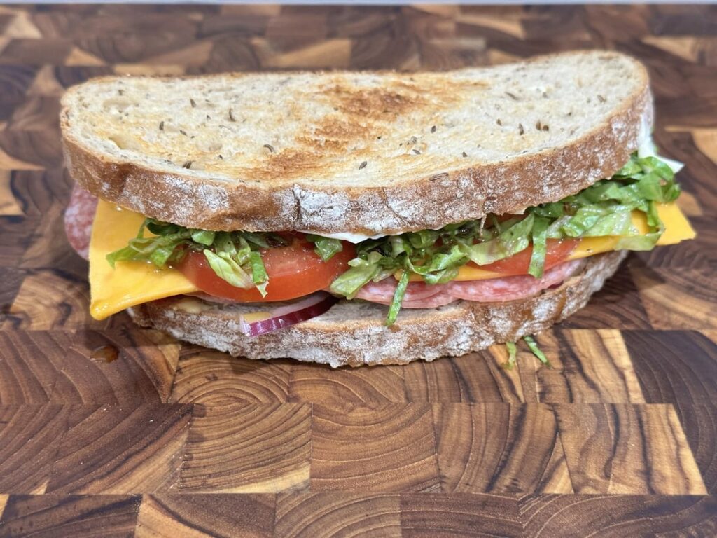 salami and cheddar on toasted rye w/ lettuce, tomato, red onion, pickle, mayo and dijon