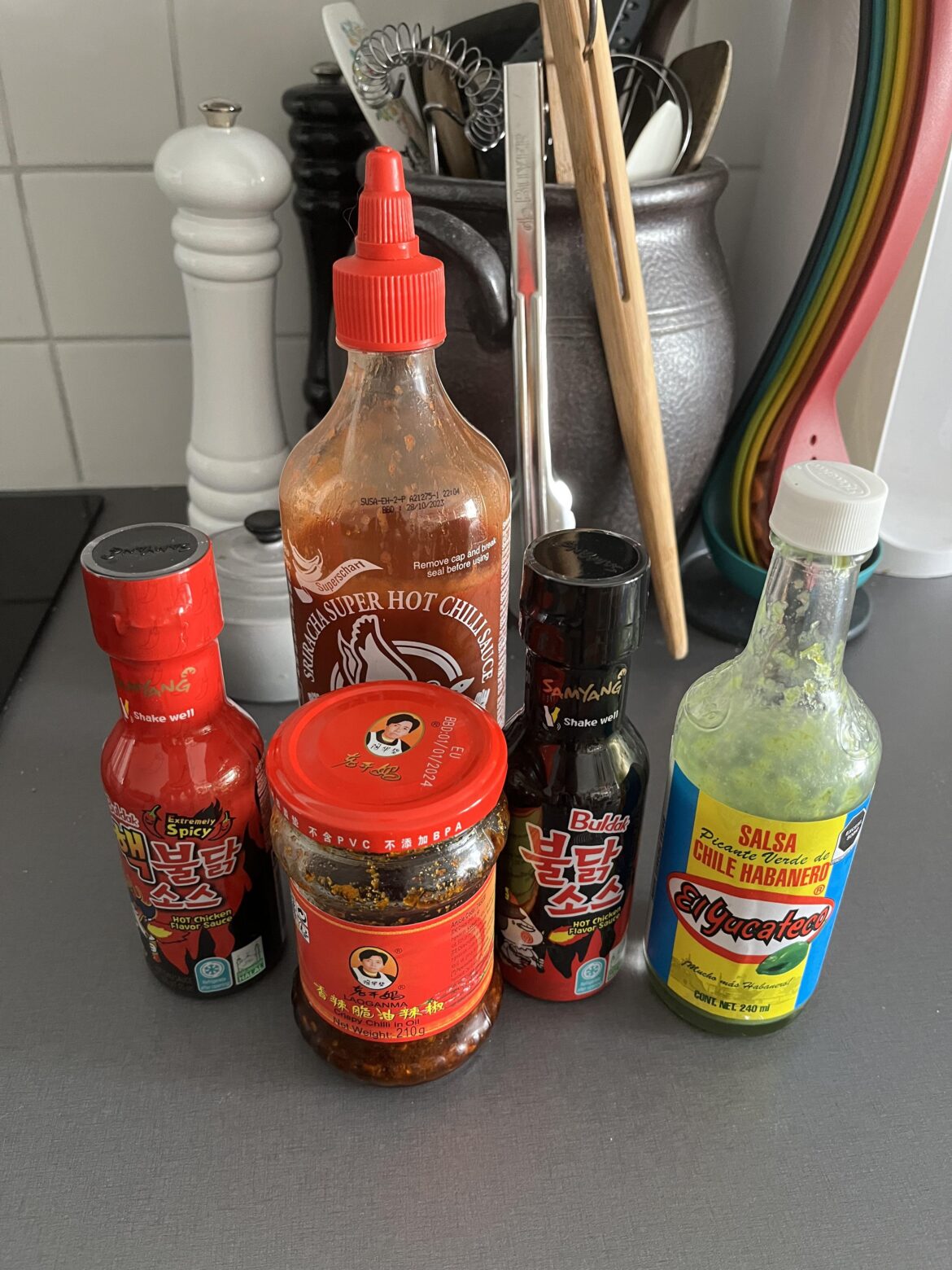 Finally found some Buldak sauce at a local asian market. Along with the chili oil, extra spicy sriracha, and the El Yucateco as my daily drivers.