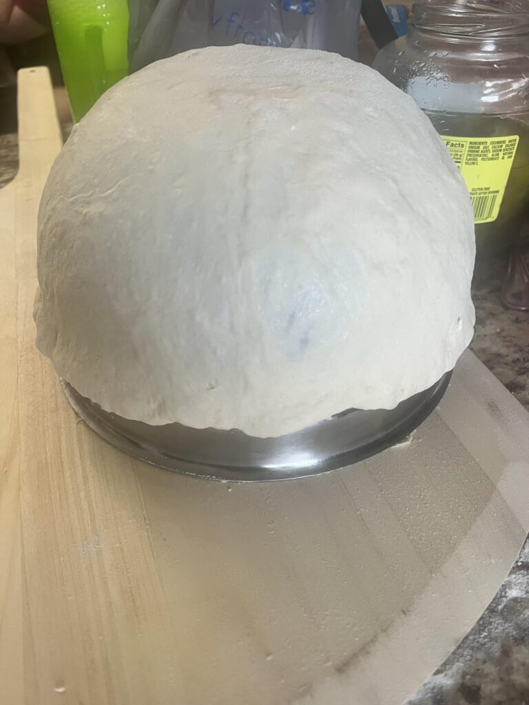 Use a bowl to stretch your dough and make a perfectly round pizza. Enjoy! Sorry I forgot to take a pic of the pizza after it was cooked. Turkey bacon cheeseburger pizza! Was delicious.