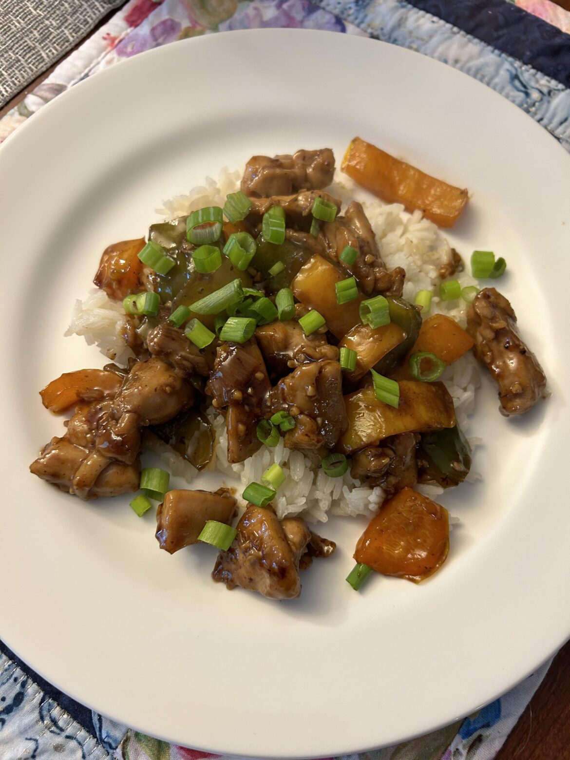 Chicken Teriyaki stir fry with bell peppers and green onions over Jasmine rice