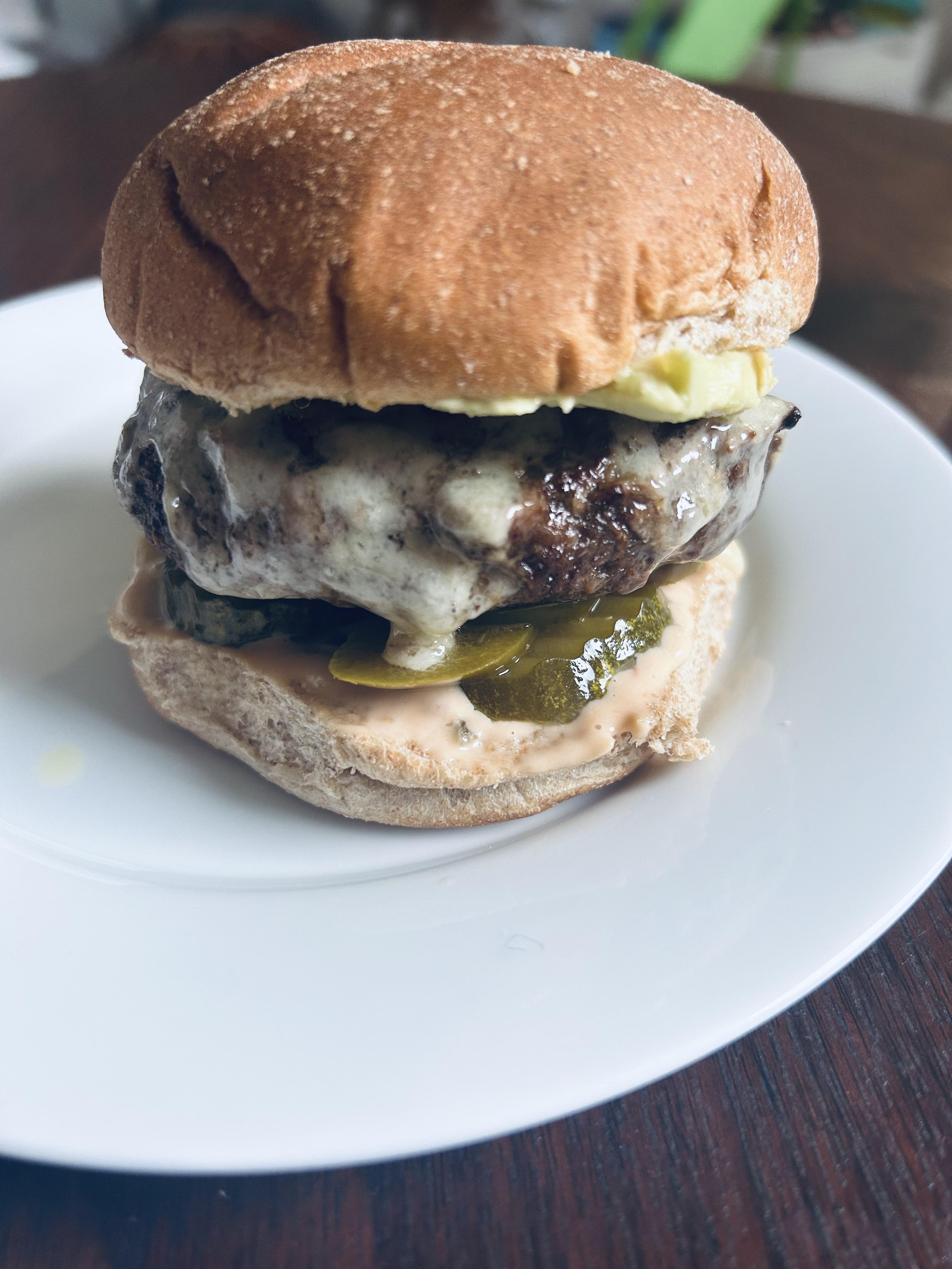 Spicy Avacado White Cheddar Cheese Burger w/ spicy pickles, jalapeños