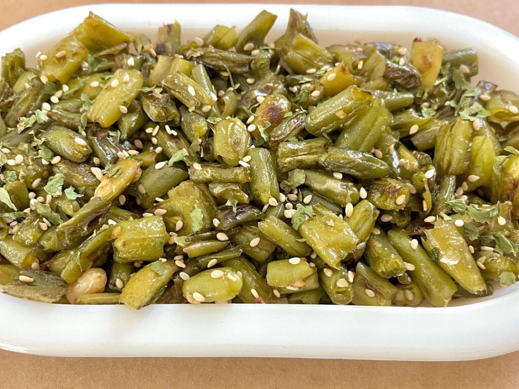 Honey and Soy glazed green bean sauté with garlic and sesame.