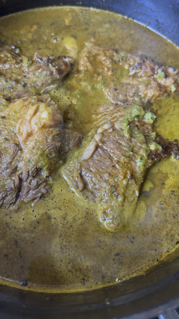 Beef sandwich with bacon, egg, cheese, peppers and onions.