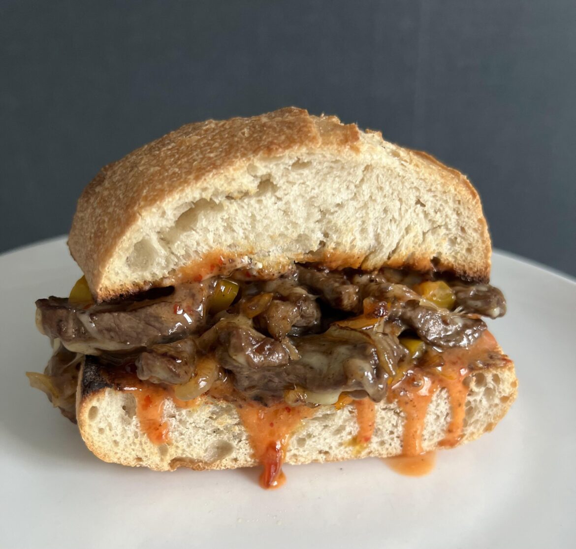 chopped steak, peppers, onions and cheddar with chili jam on sourdough baguette.
