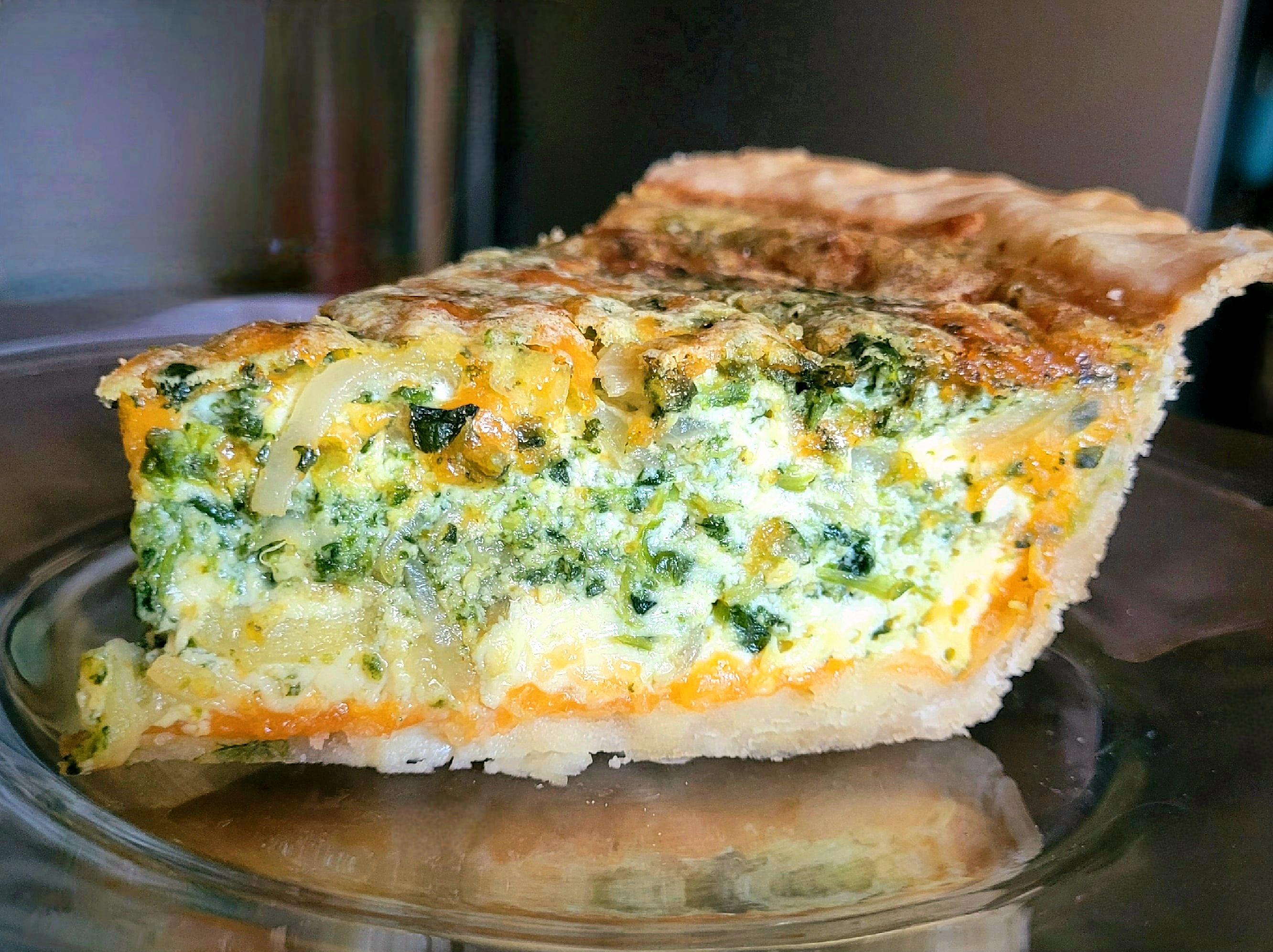 [homemade] quiche with farm eggs, cream, spinach, sweet onion, cheddar