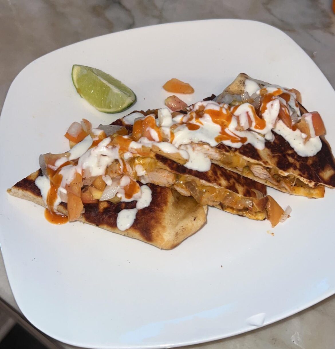 Baja Chicken Quesadillas with Salsa Fresca, Lime Crema & Hot Sauce