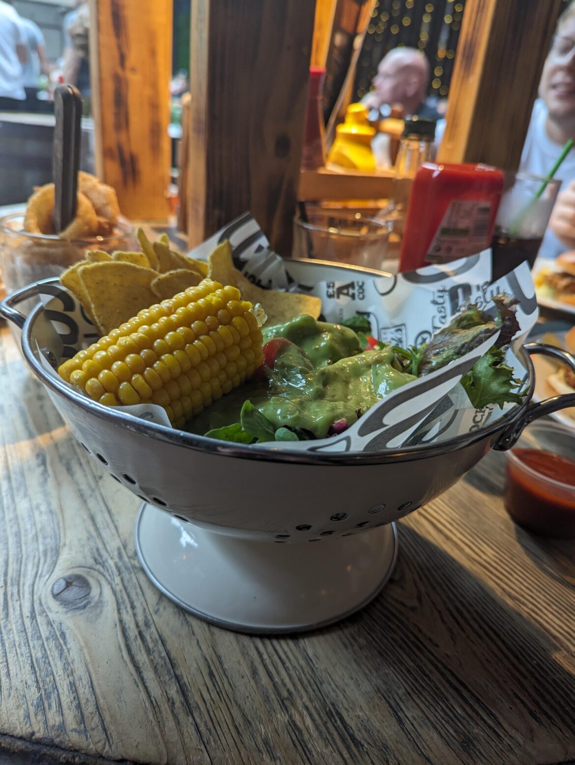 Colander of salad and a pint of of onion rings please