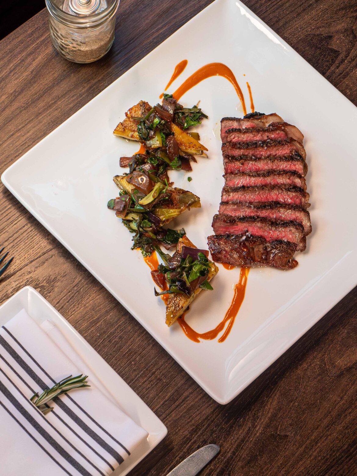 NY Strip, Manchego Gratin, Carmalized Onion, Romesco Butter