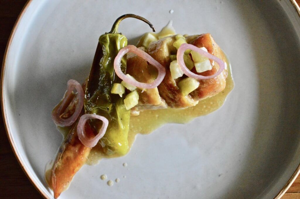 Stuffed Chicken Wing, Chicken Sausage, Shishito, Tomatillo and Shallot Pickles, Grilled Cabbage and Tomatillo Jus