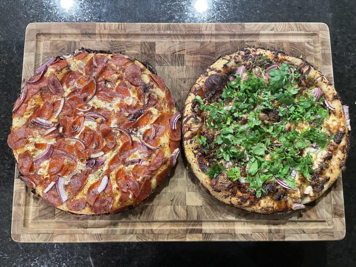 Pepperoni, onion, and mushroom pizza and BBQ pork pizza