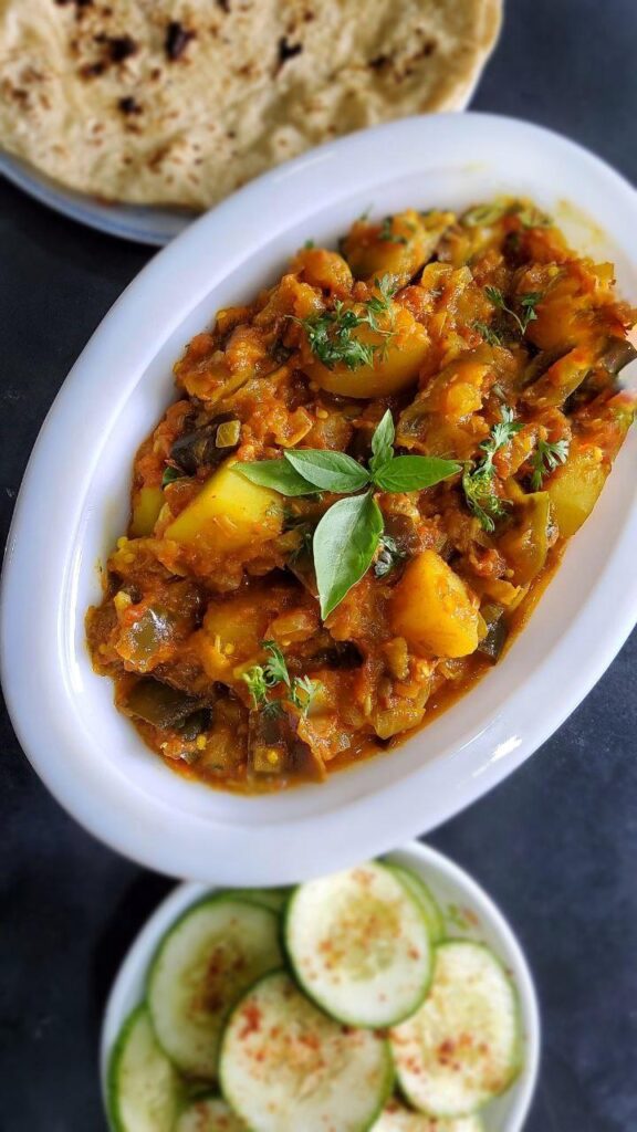 Vegan and gluten free Eggplant- Potato Curry is a delicious and flavorful Indian, Punjabi style semi dry curry recipe. This recipe is simple to make, gets ready under 30 minutes and nutritious main course dish for busy weekdays.