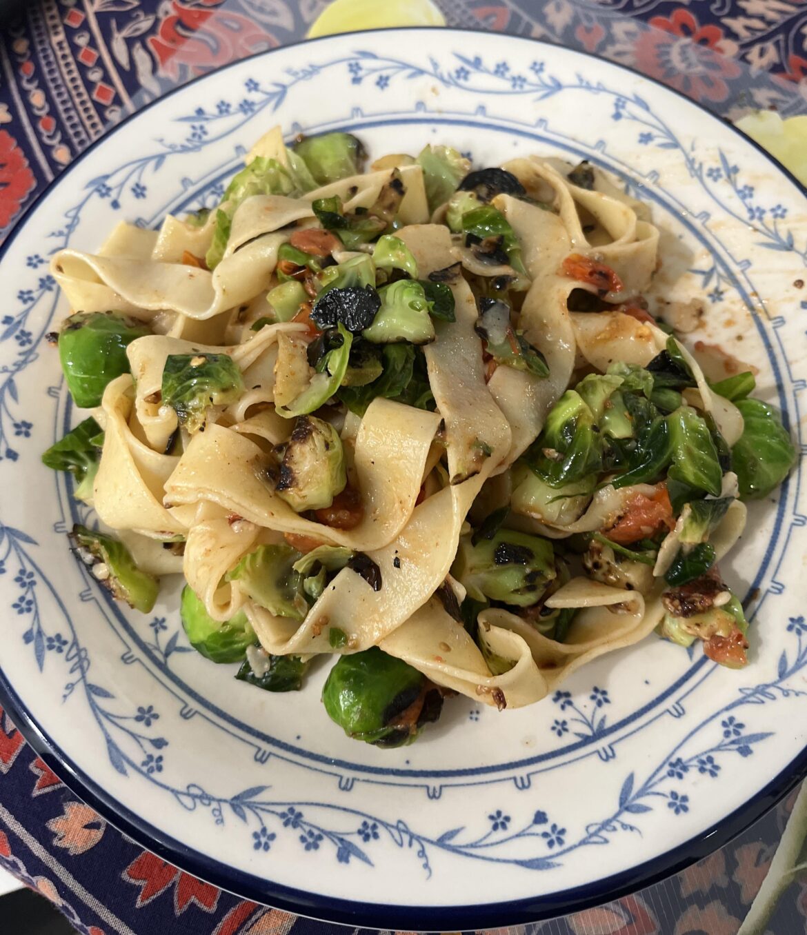 Parparedelle with brussel sprouts and Roma tomatoes