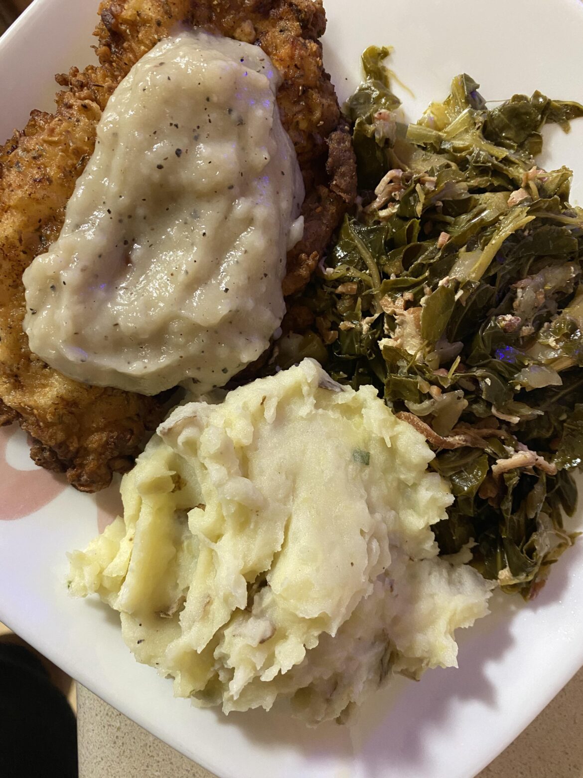 Counrty fried chicken, collard greens and mashed potatoes.