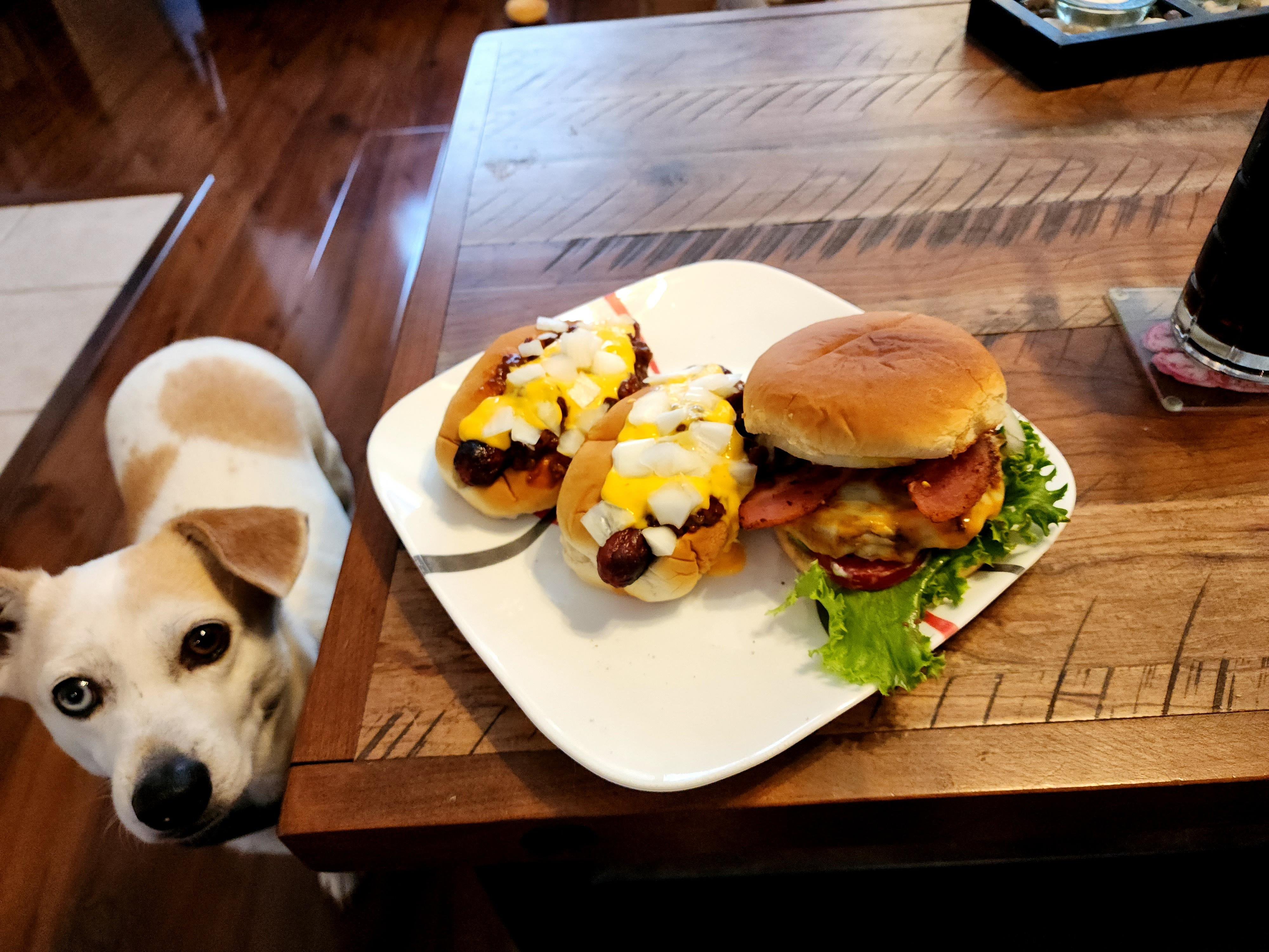 Bacon cheeseburger with a side of chili cheese dogs for America's birthday. Dining and Cooking