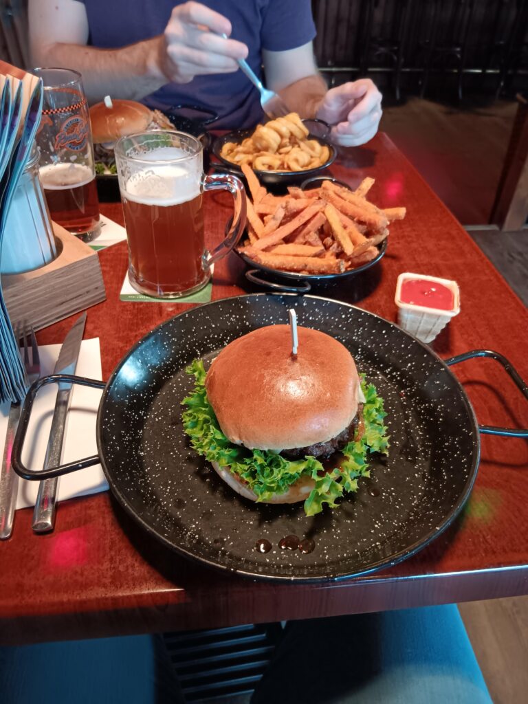 Burger in a pan and Ketchup in a waffle cone..