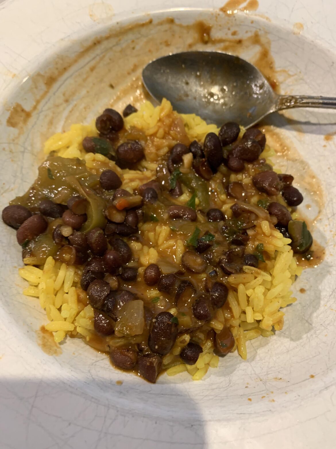 Black bean soup/stew over leftover turmeric rice.