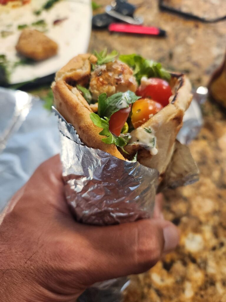 Everything but the bagel crusted cod on flatbread, with home made taziki.