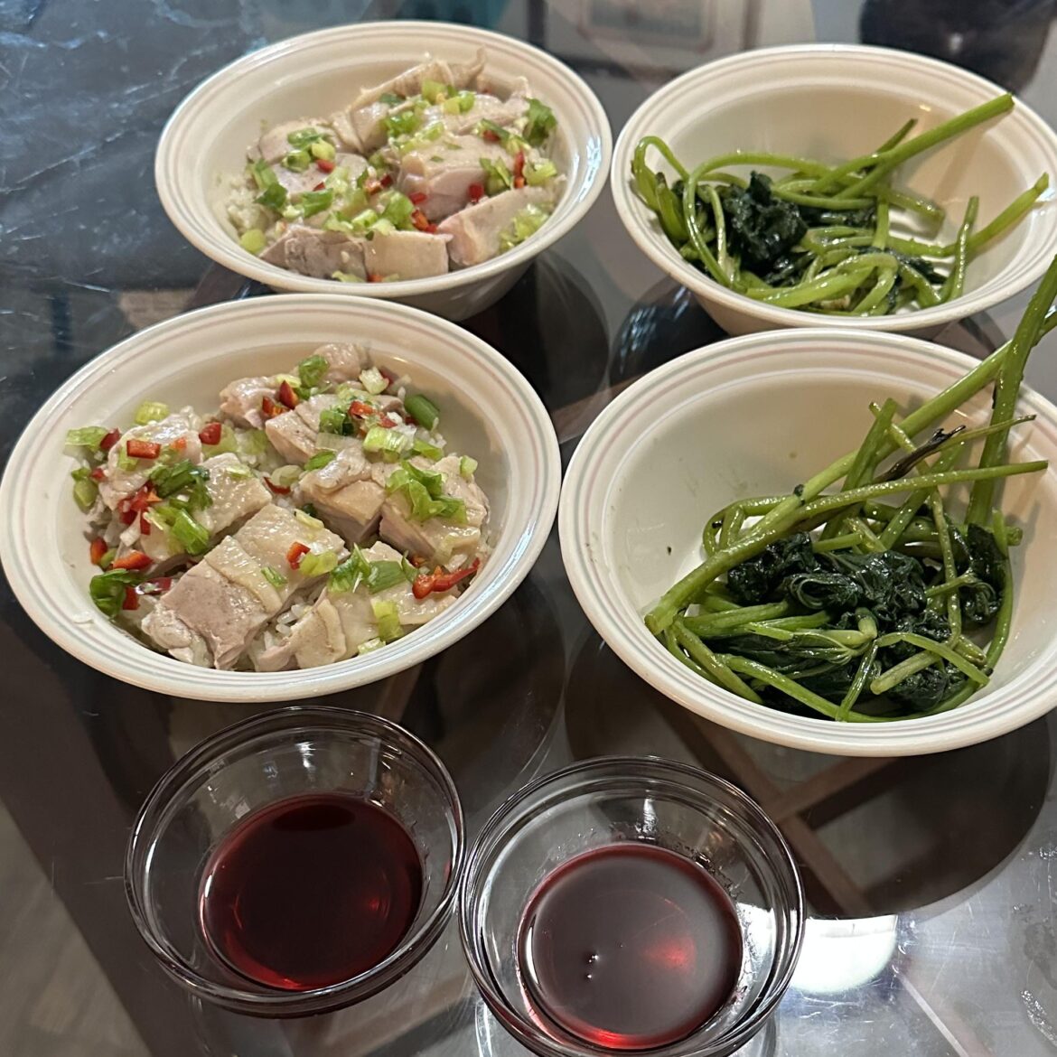 Sous vide chicken on hainanese chicken rice with homemade sweet-and-sour sauce and stir fry yam leaves. 615 calories