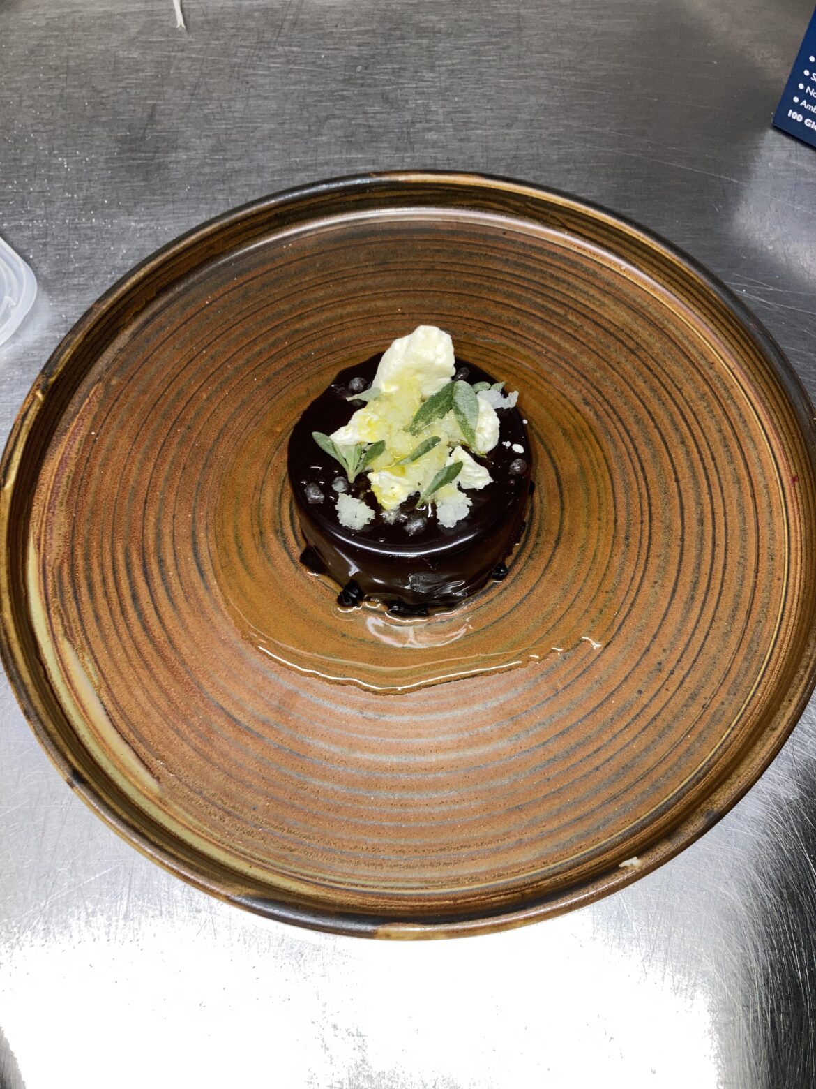 Aged dark choc, olive oil and orange delice, cardamom white choc aero, burnt orange honey, extra virgin olive oil granita and sea purslane